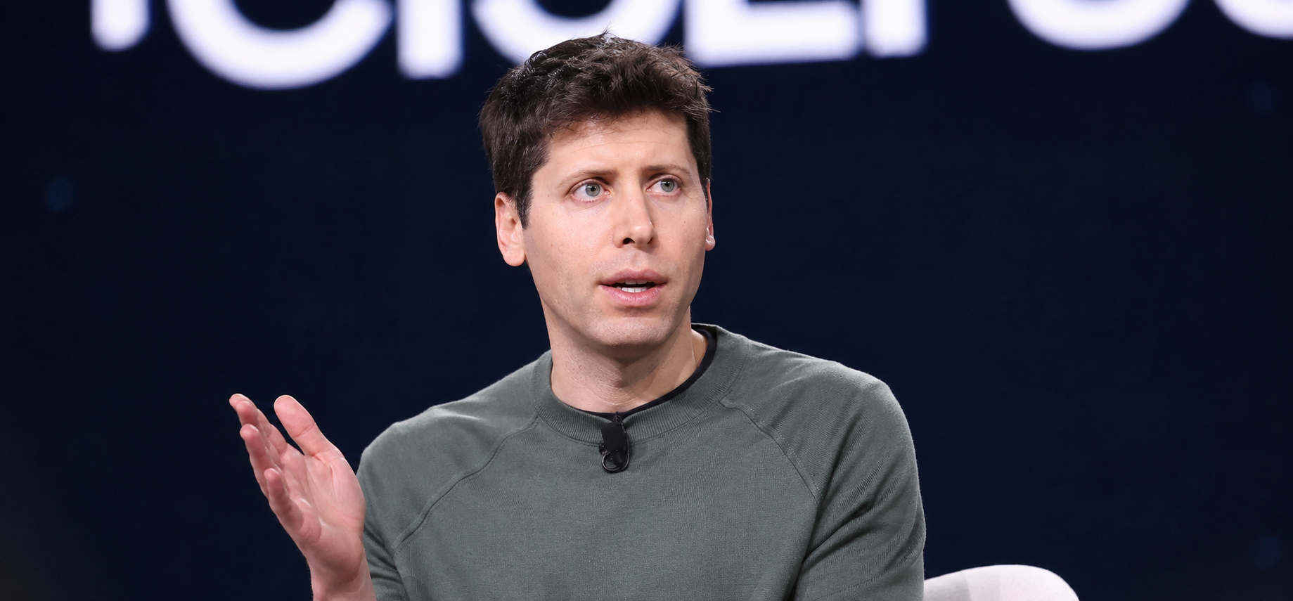 openai ceo sam altman speaking at a conference
