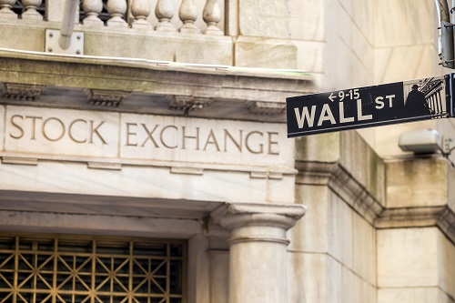 Wall Street sign outside the New York Stock Exchange building