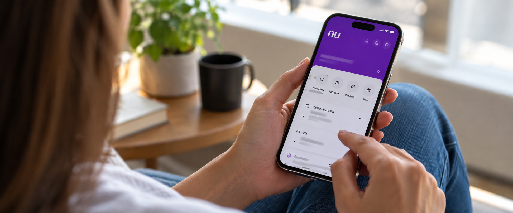 A person checking Nu Holding's app on phone