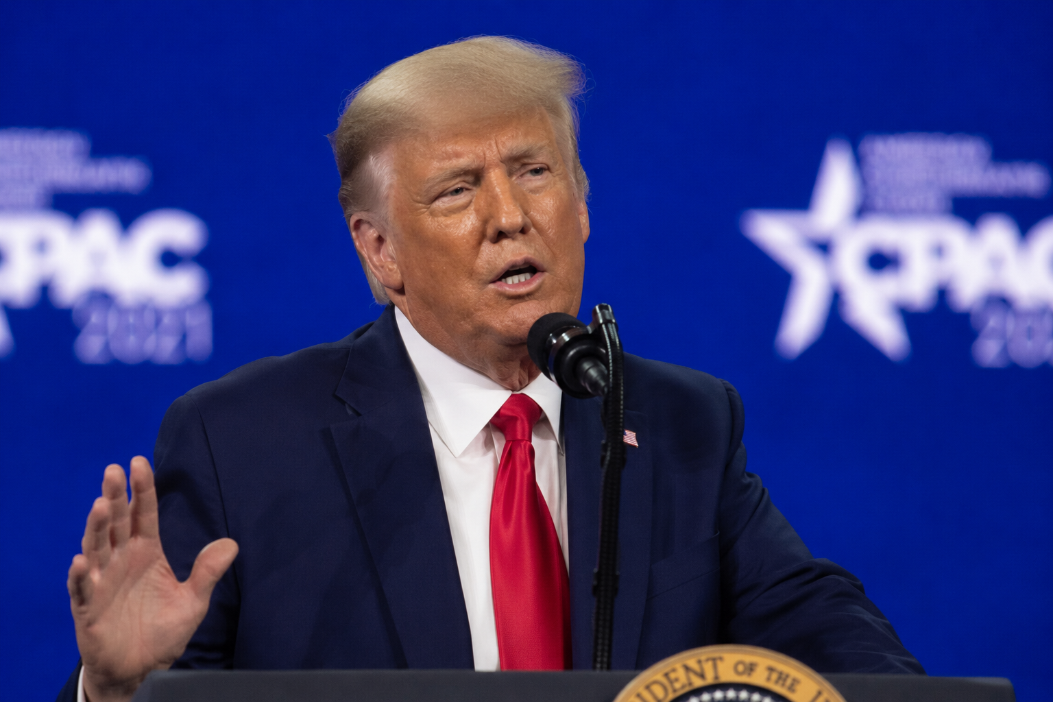 Donald Trump speaking at a conference