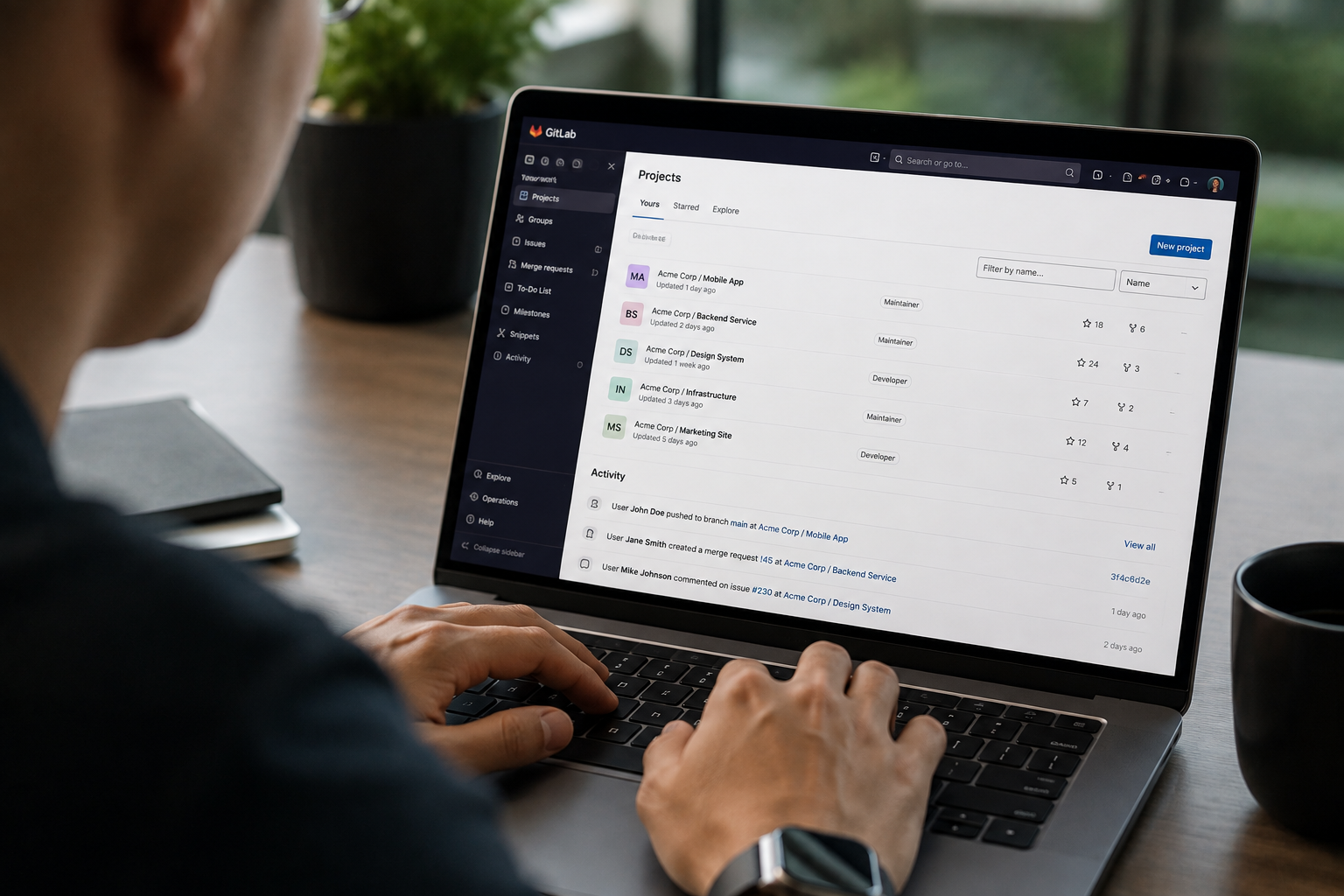 A person using Gitlab on a laptop