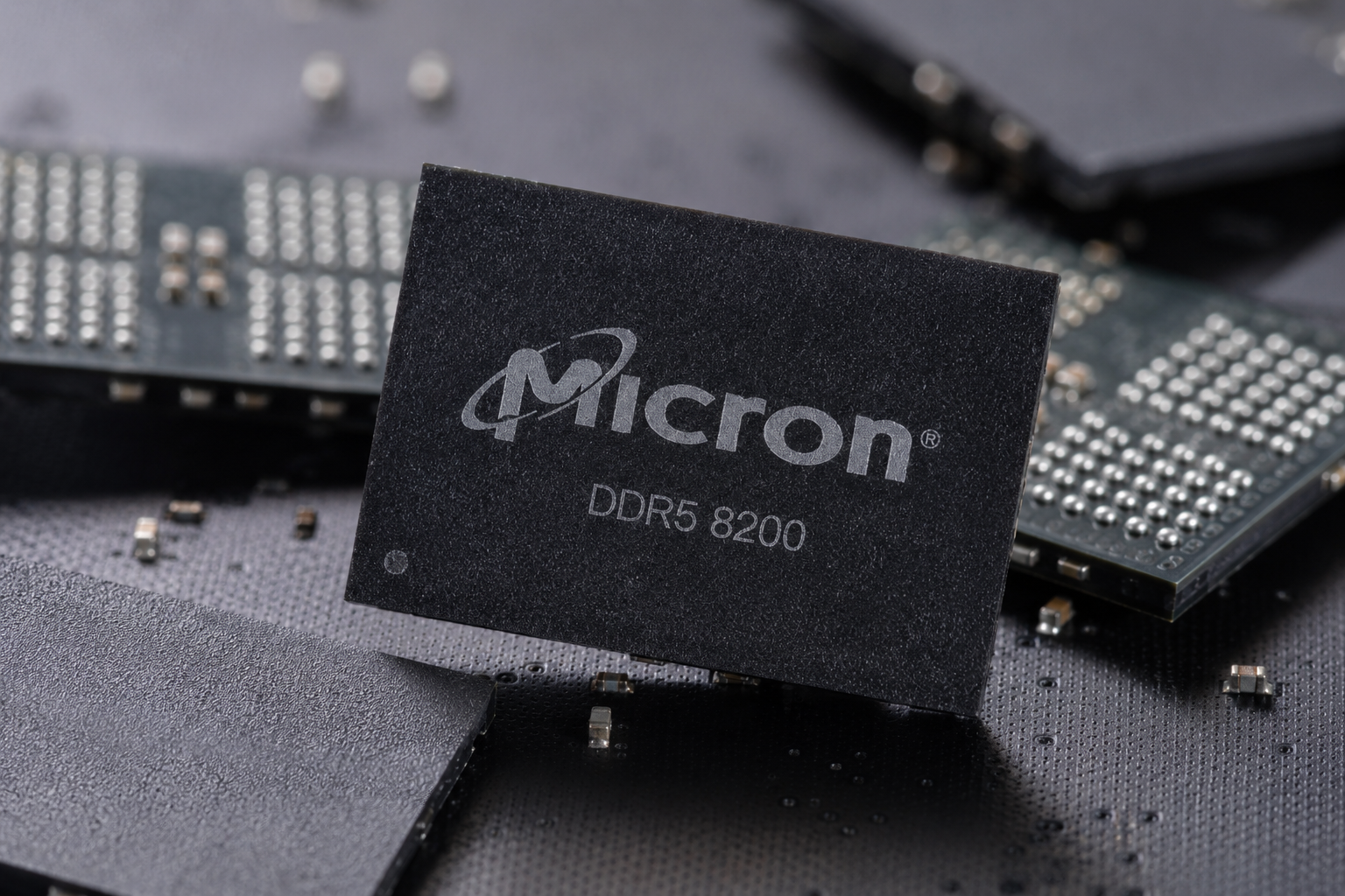 Micron DDR5 8200 memory chip displayed among semiconductor components.