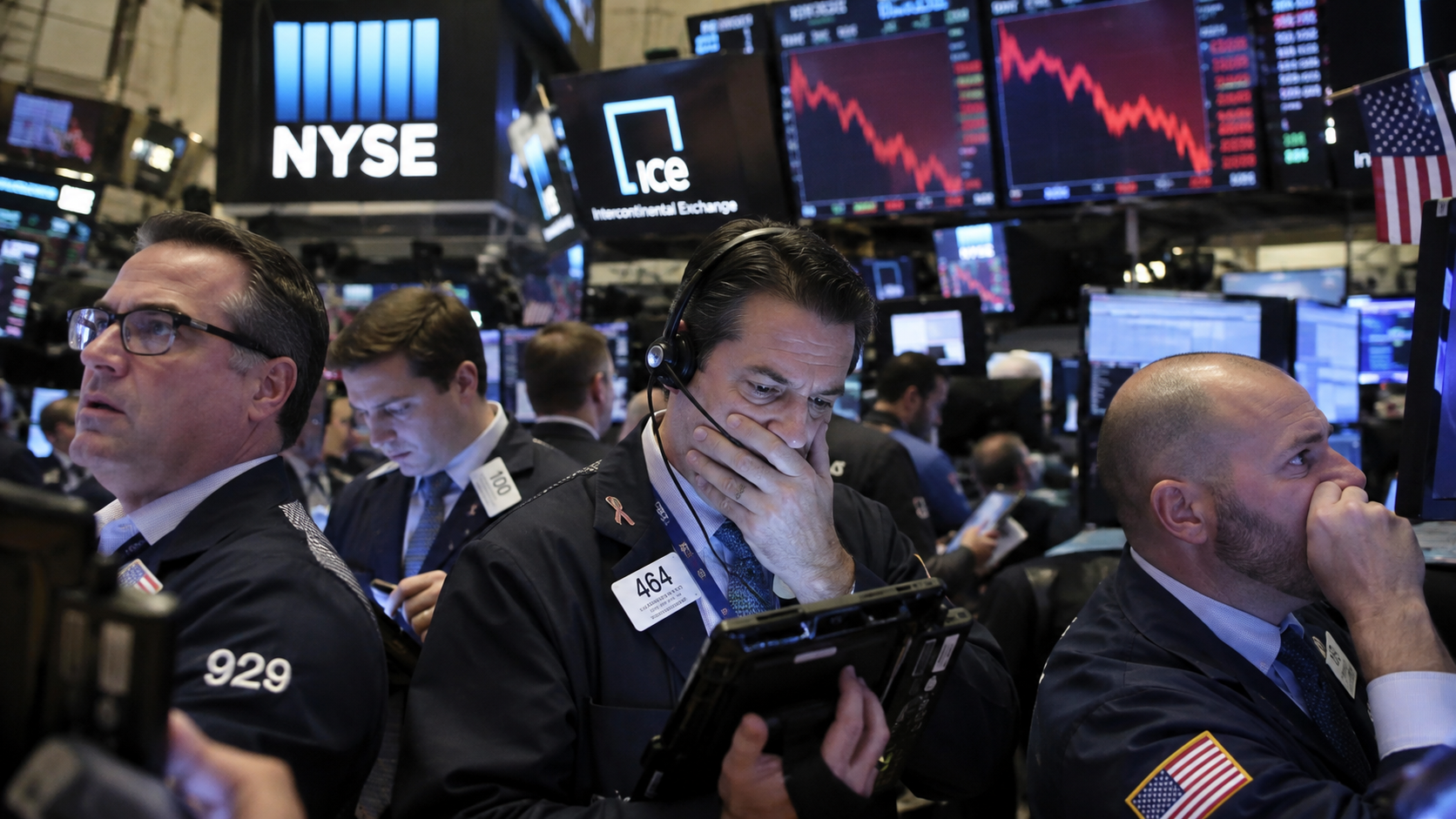 NYSE traders watch sharply falling market charts on the New York Stock Exchange floor as selling pressure hits US stocks.