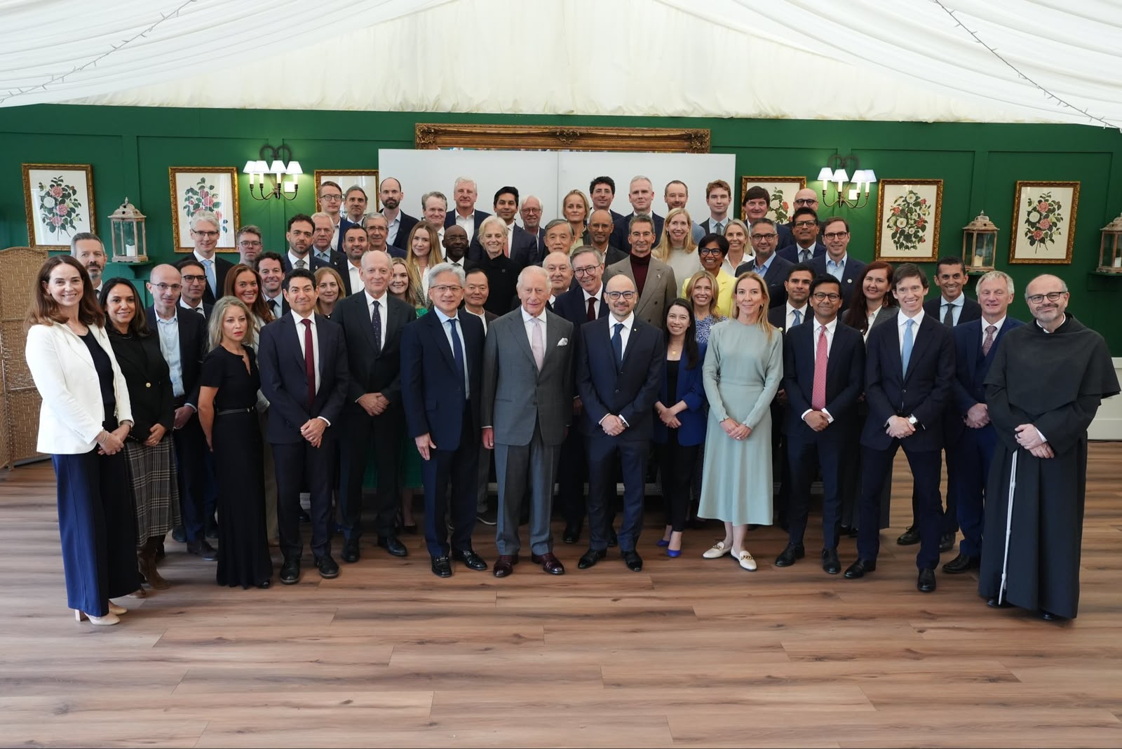 King Charles III standing with a group of AI industry leaders and policymakers at Dumfries House, Scotland.