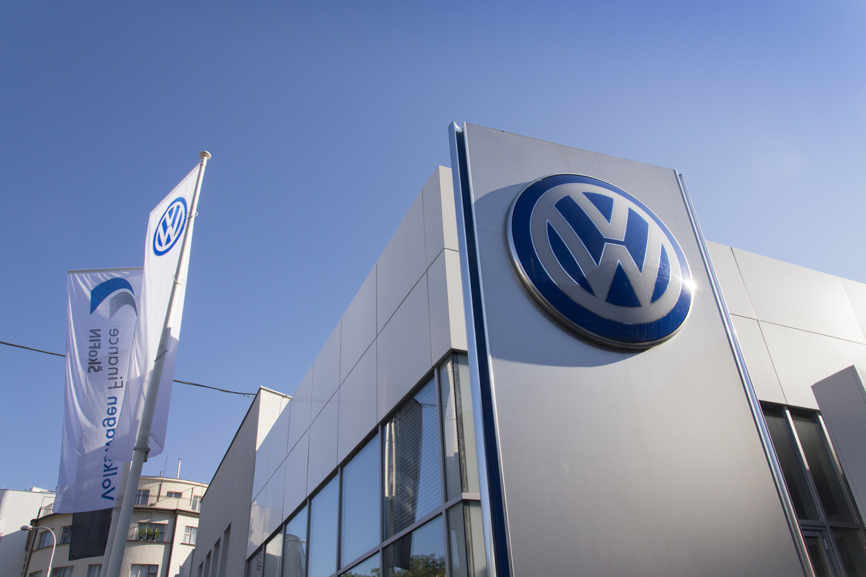 Volkswagen logo displayed on the exterior of a modern dealership building