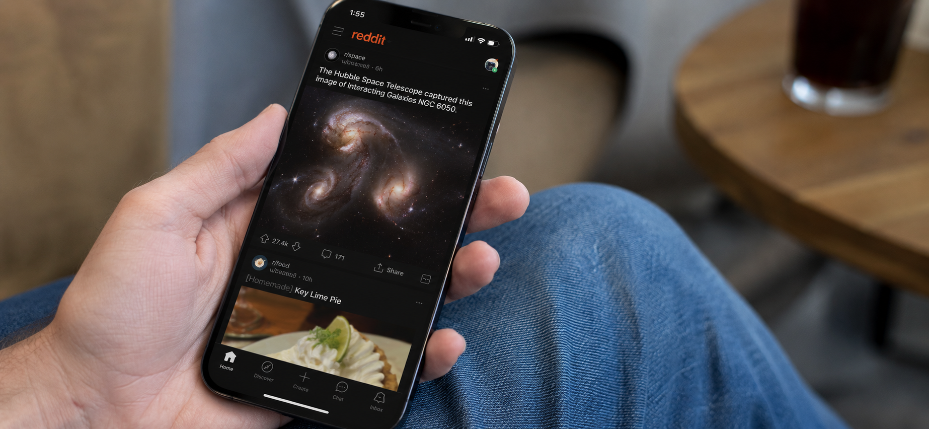 A person checking reddit app on phone